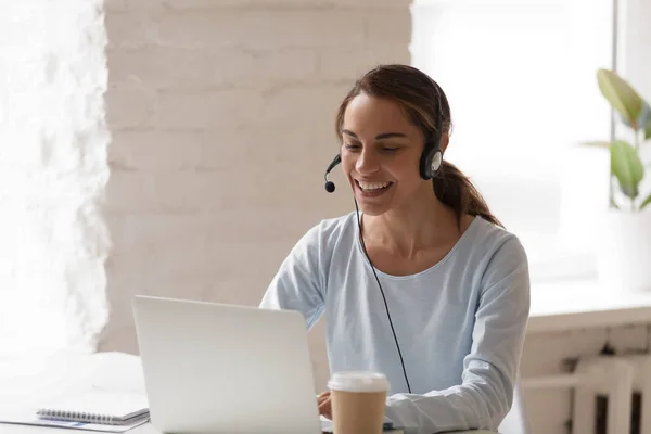 Beautiful smiling woman man working in headphones at office — Stock Photo, Image