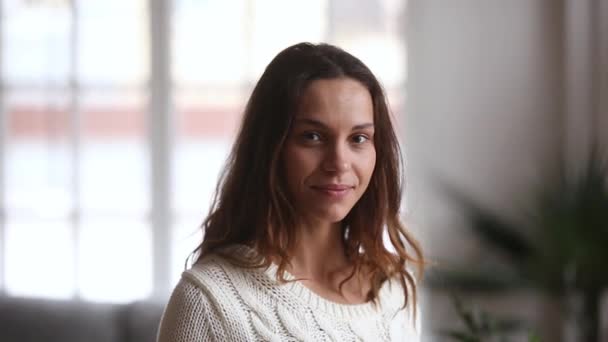 Video portrait of happy young woman posing at home — Stock Video