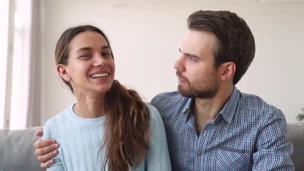 Young couple vloggers embracing recording video blog at home — Stock Video