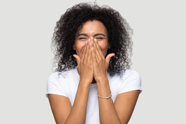 Happy excited african woman isolated on grey blank background — Stock Photo, Image