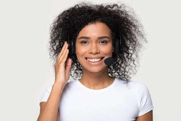 Mixed race female wearing headset smiling looking at camera — Stock Photo, Image