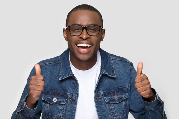 Happy african man showing thumbs up laughing looking at camera — Stock Photo, Image