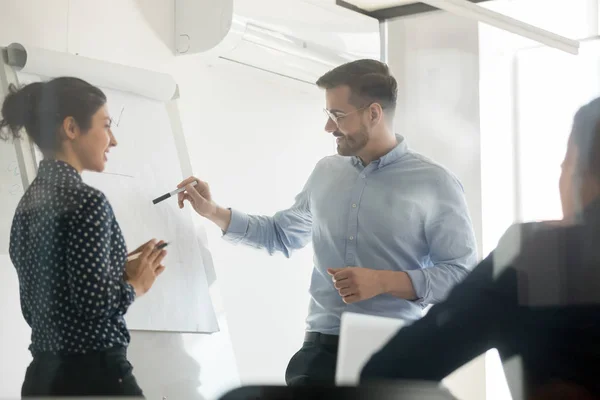 Diverse speakers make flip chart presentation in conference room — Stock Photo, Image