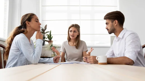 Angry furious female boss scolding employees for bad work — Stock Photo, Image
