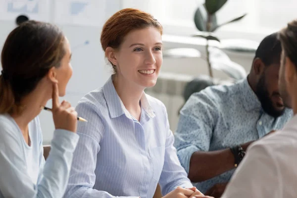 Multiracial business people sitting at office desk — Stock Photo, Image