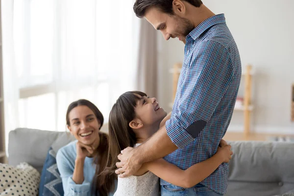 Happy little child hug dad excited parents reunited — Stock Photo, Image