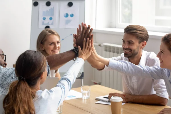 Happy motivated diverse members of business team join hands together — Stock Photo, Image