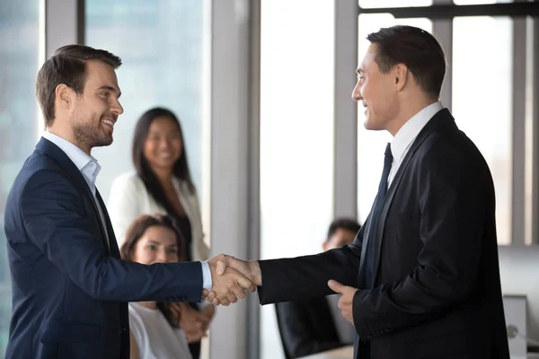 Happy business partners handshake congratulating with deal closing — Stock Photo, Image