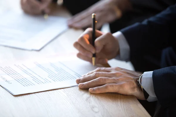Close up of businessmen sign business contract after briefing — Stock Photo, Image