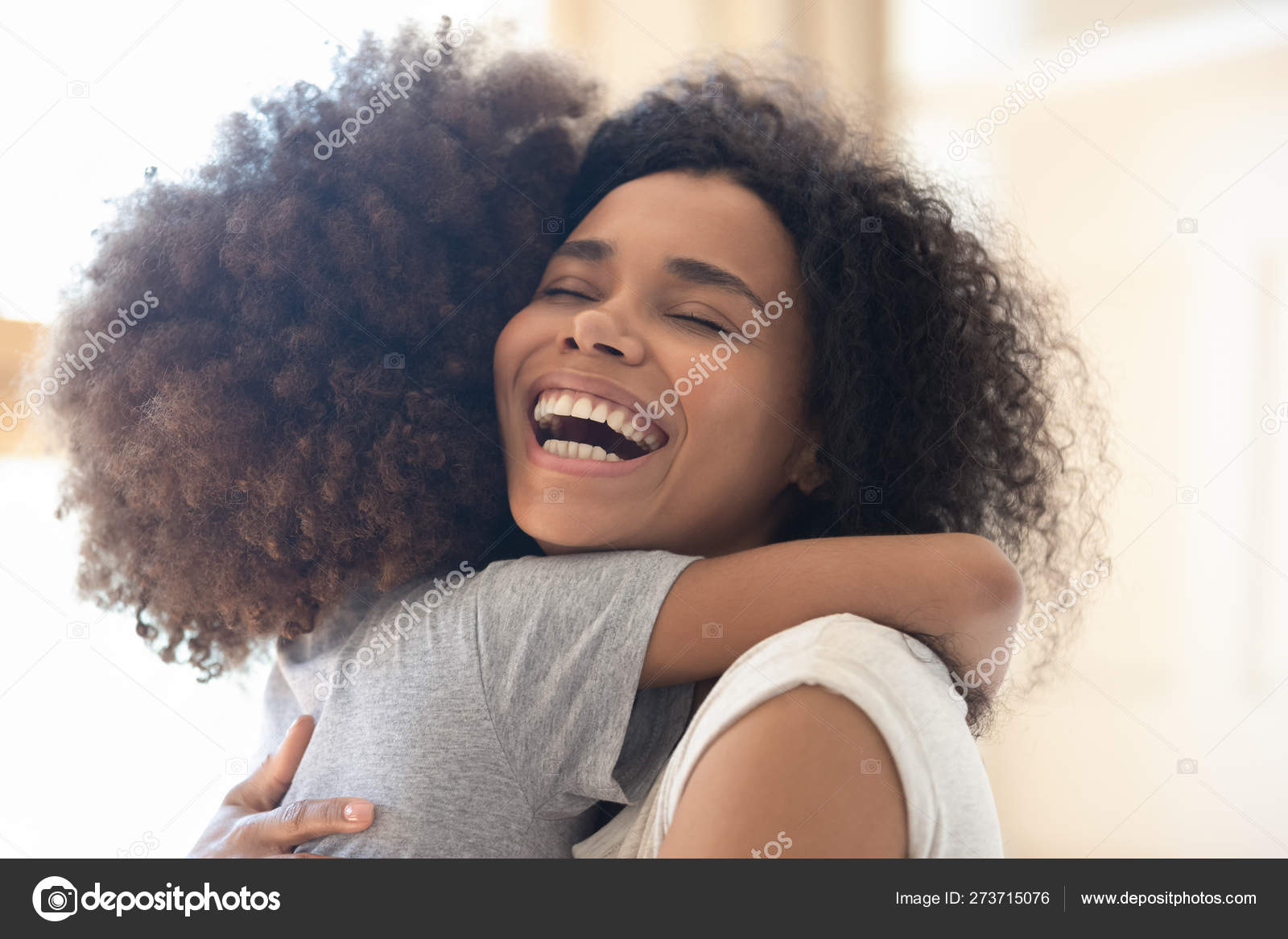 Happy Overjoyed African Single Mother Hugging Cute Little