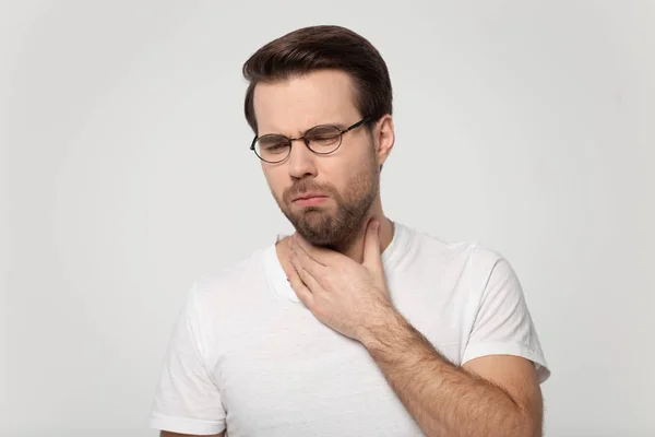 Young guy coughing having sore throat studio shot — Stock Photo, Image