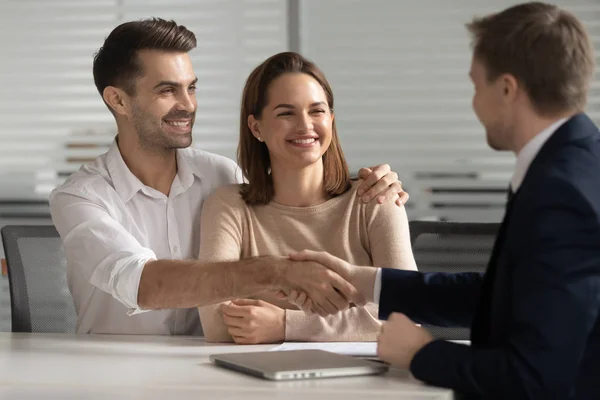 Happy young couple handshake lawyer insurer broker make business deal — Stock Photo, Image