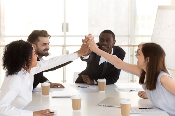 Diverse colleague giving high five, celebrating corporate success — Stock Photo, Image