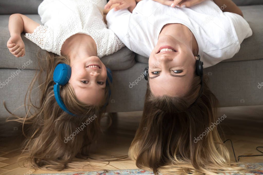 Mom and kid have fun together listening music