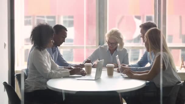 Multiracial business partners entities sitting in board room signing contract — Stock Video