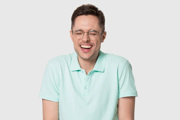 Headshot portrait funny man in glasses laughing on grey background — Stock Photo, Image