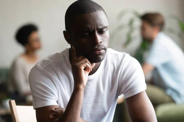 Unhappy black male loner feel hurt sitting alone — Stock Photo, Image