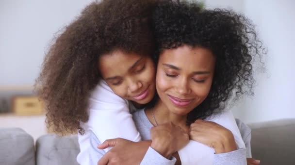 Daughter embracing mother closed eyes enjoy moment of tenderness closeup — Stock Video