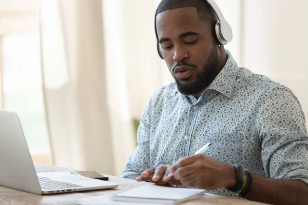 Focused black guy busy with certification training. — Stock Photo, Image