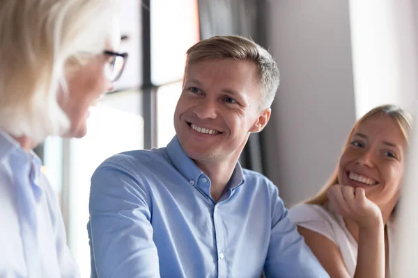 Close up of excited couple have consultation with female agent — Stock Photo, Image