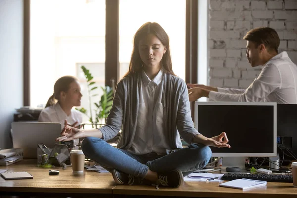 Businesswoman meditating at workplace, avoiding problem at work — Stock Photo, Image