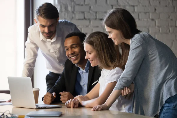 Smiling diverse employees team watching webinar on laptop together — Stock Photo, Image