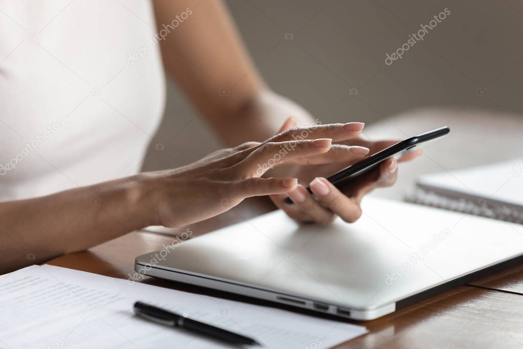 Close up of female hold cellphone texting message