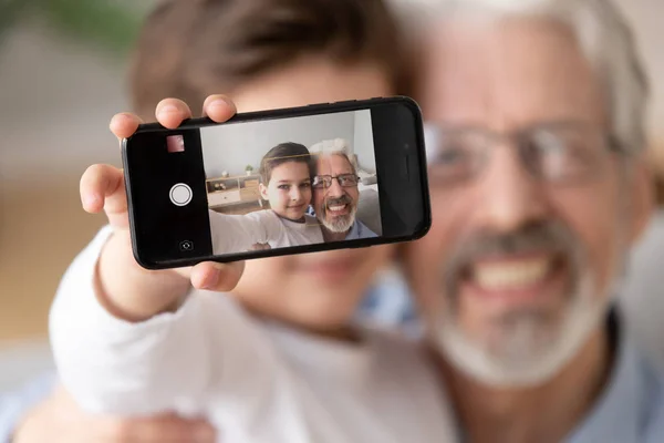 Cute grandson embrace old grandfather take selfie on mobile phone — Stock Photo, Image