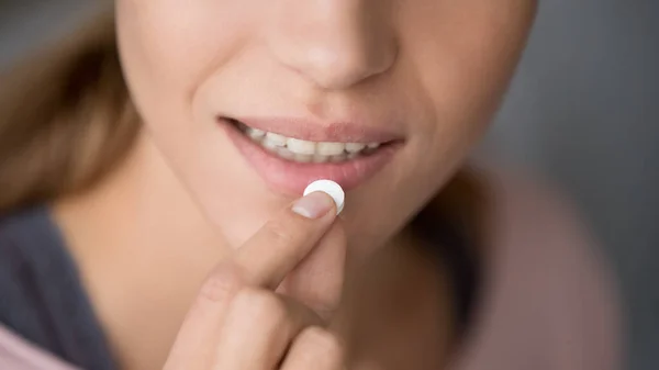 Young woman holding pill take meds, close up view — Stock Photo, Image