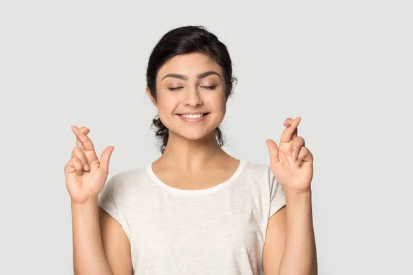 Smiling indian girl cross fingers make wish — Stock Photo, Image