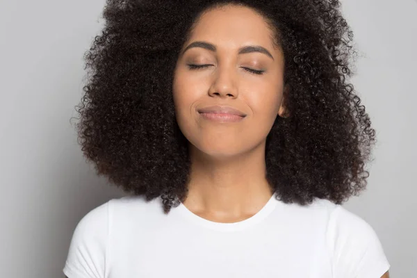 Happy african American girl with eyes closed relieve negativity — Stock Photo, Image