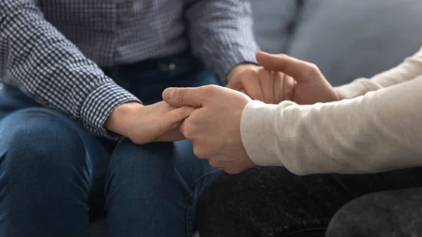 Close up young couple joining hands together. — Stock Photo, Image