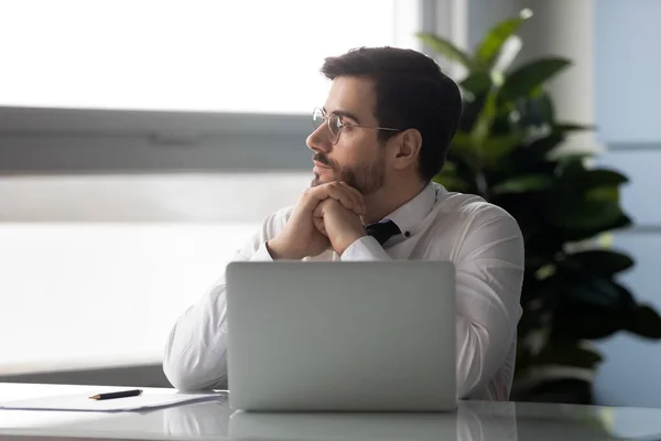 Distracted from job millennial businessman looking aside. — Stock Photo, Image