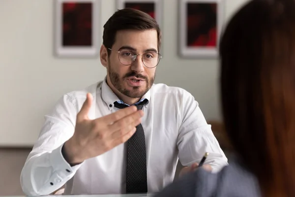 Serious concentrated hr manager holding interview with female candidate. — Stock Photo, Image