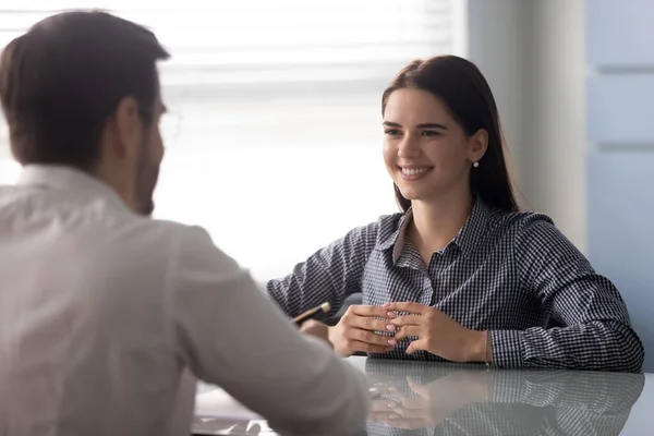 Smiling woman listening to questions of employer. — Stock Photo, Image