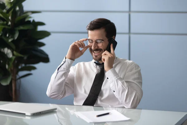 Happy manager holding pleasant call with partners. — Stock Photo, Image