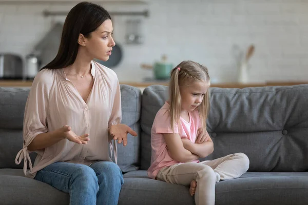 Stubborn upset little daughter ignoring strict mother, family conflict — Stock Photo, Image
