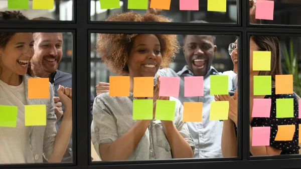 Diverse team celebrating accomplishment of profitable commercial project — Stock Photo, Image