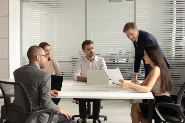Diverse employees team discussing legal documents at briefing — Stock Photo, Image