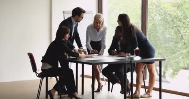 Diverse executive team work in teamwork in modern office
