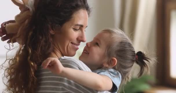 Affectionate mother embrace cute child daughter bonding cuddling hugging — Αρχείο Βίντεο