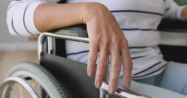 Handicapped disabled old woman sit on wheelchair, close up view — Stock Video