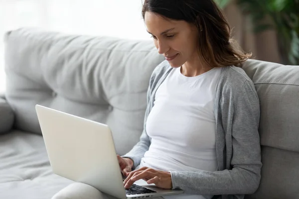 Peaceful calm millennial mixed race woman working with laptop. — Stock Photo, Image