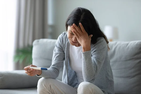 Stressed biracial young girl worrying about unwished pregnancy. — Stock Photo, Image