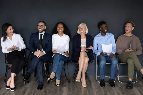 Happy multiracial businesspeople group sit on chairs laughing, human resource — Stock Photo, Image