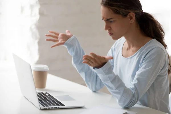 Stressed mixed race female employee irritated by bad computer work. — Stock Photo, Image