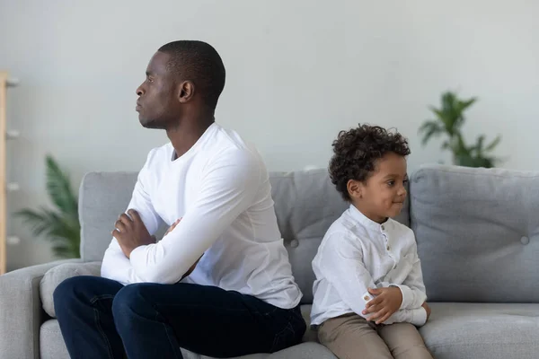 Ethnic dad and little son avoid talking after conflict — Stock Photo, Image