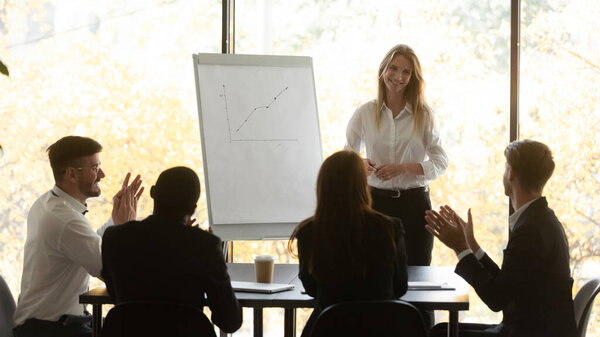 Business audience applaud happy female presenter thank for conference seminar