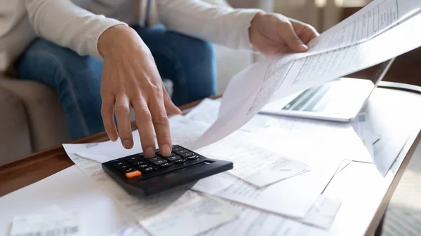 Close up of woman manage home finances calculating on machine — Stock Photo, Image