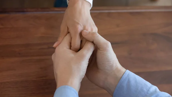 Close up of man hold wife hand ask forgiveness — Stock Photo, Image